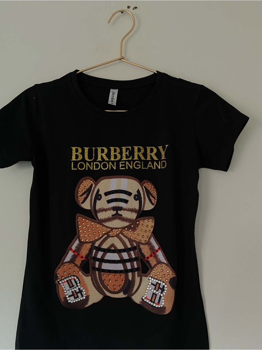 Burberry Black Tee with Gold Logo and Patterned Bear